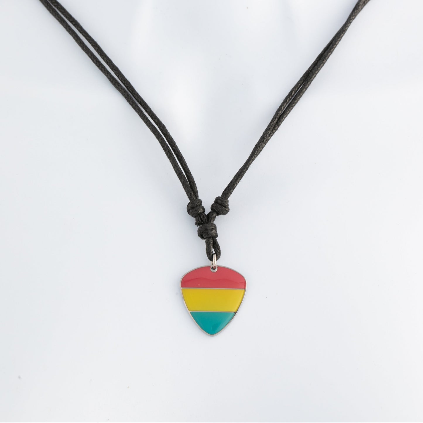 Necklace with a pansexual pride colored guitar pick pendant on a white background