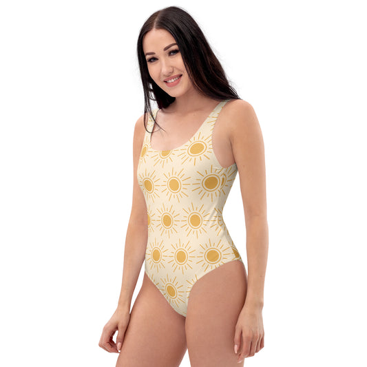 Woman wearing a peach sun one-piece swimsuit on a white background