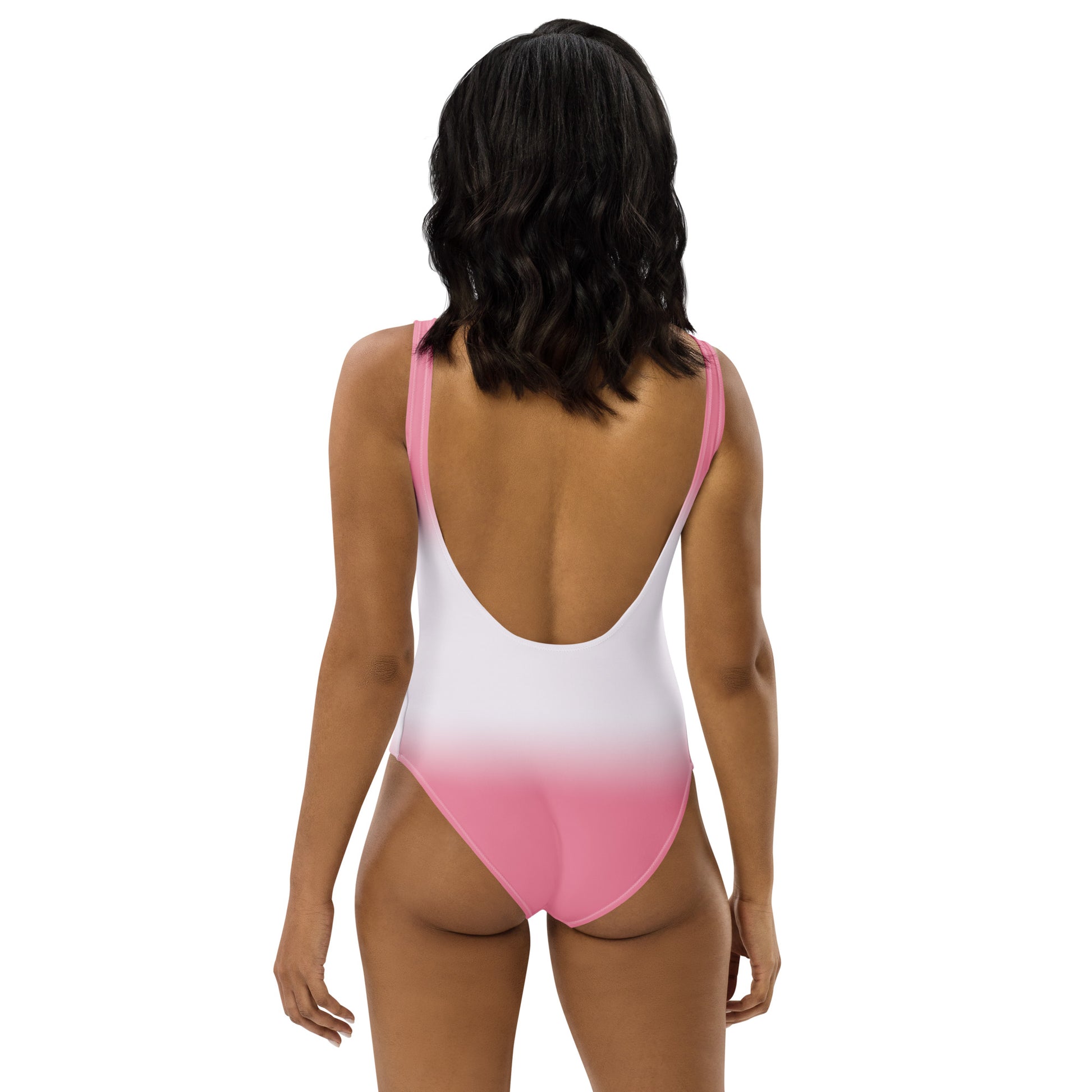 Woman wearing a pink and white gradient swimsuit on a white background