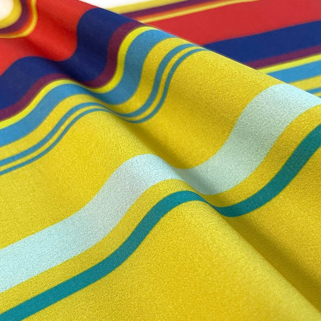 Close-up of colorful fabric with red, blue, yellow, and green stripes.