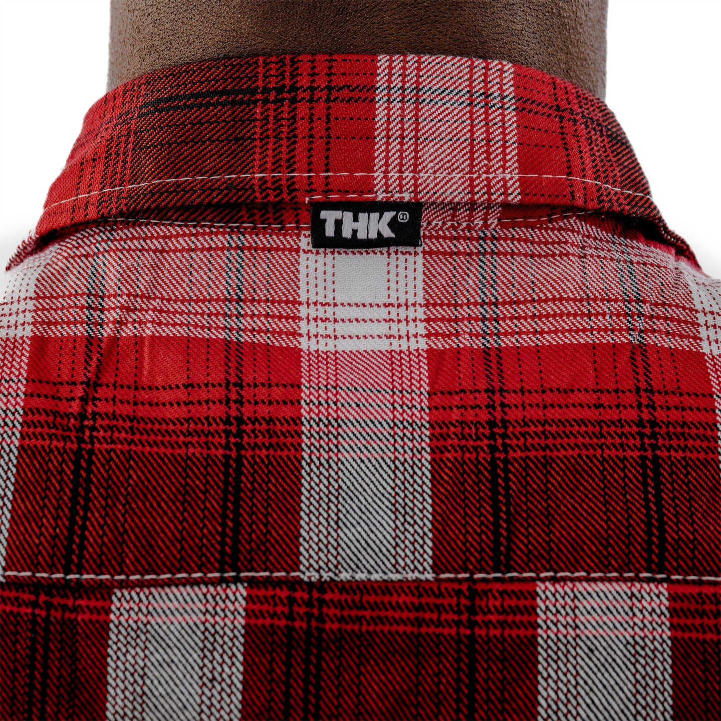 Red plaid shirt with THK label on a white background
