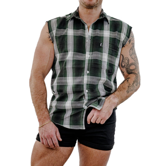 Man wearing a green and white plaid sleeveless shirt on a white background