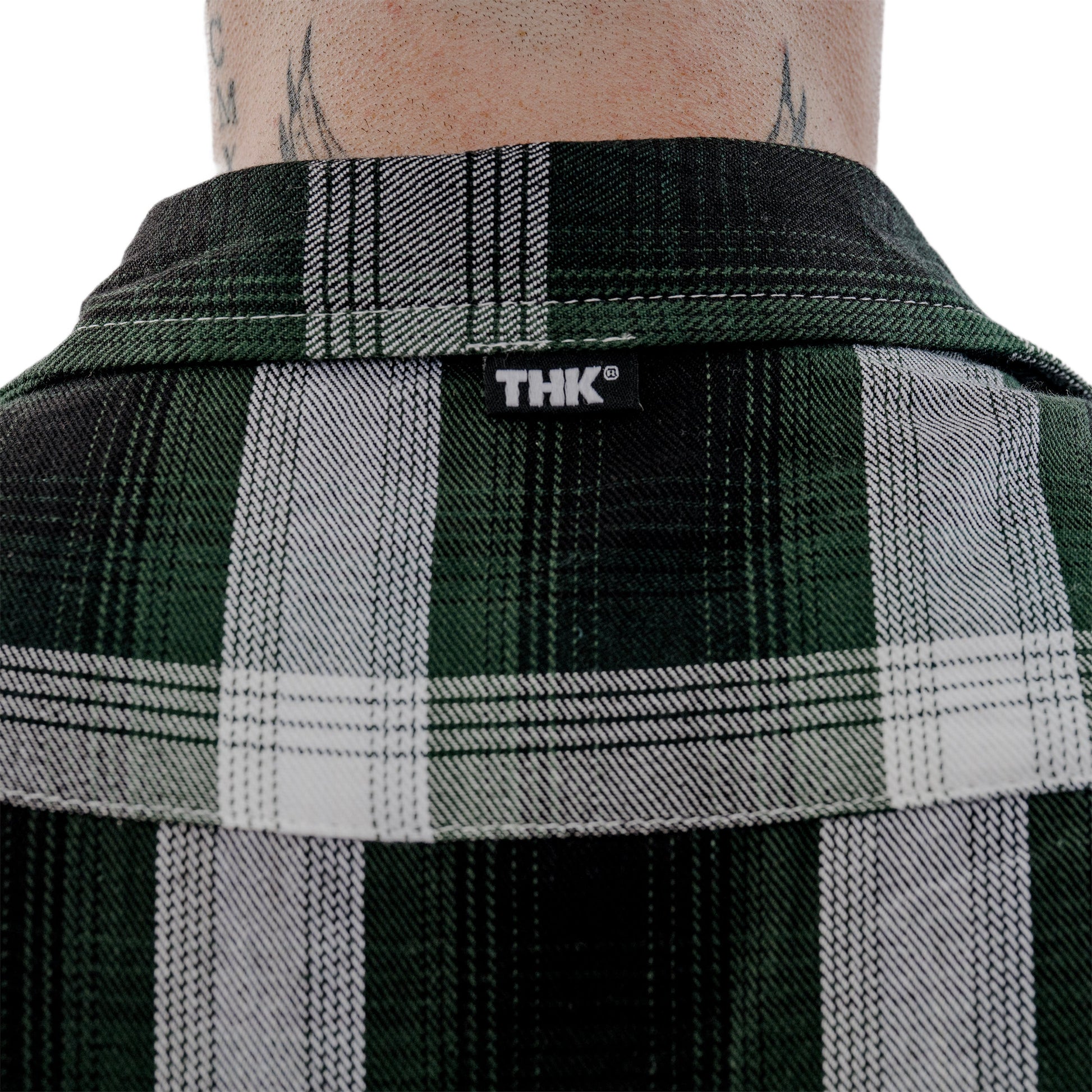 Plaid shirt collar with 'THK' logo on a white background
