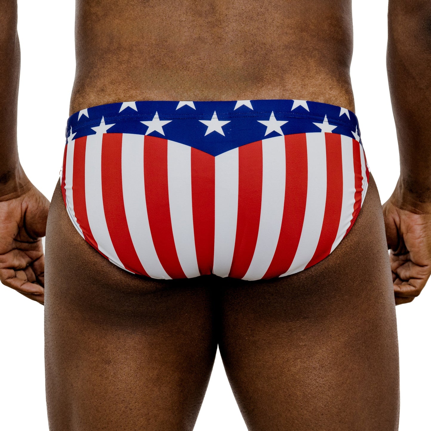 Person wearing American flag patterned swimsuit on a white background