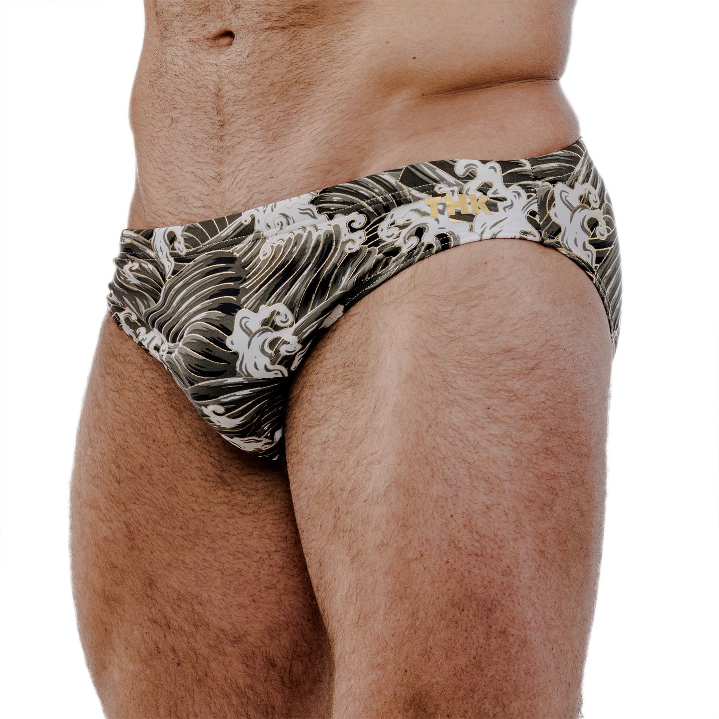 Mens swimwear with ocean wave pattern on a white background