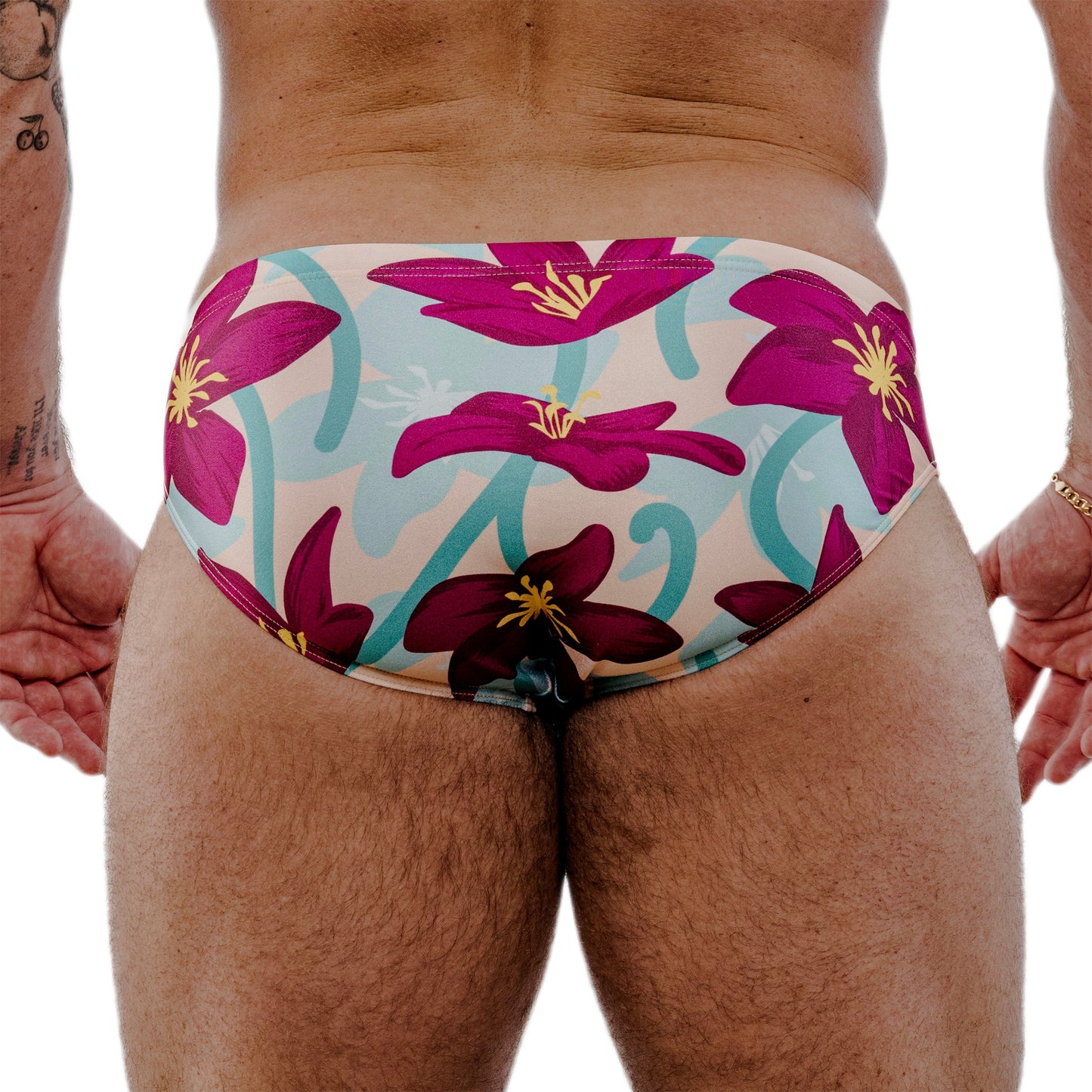 Floral-patterned swimsuit worn by a person on a white background
