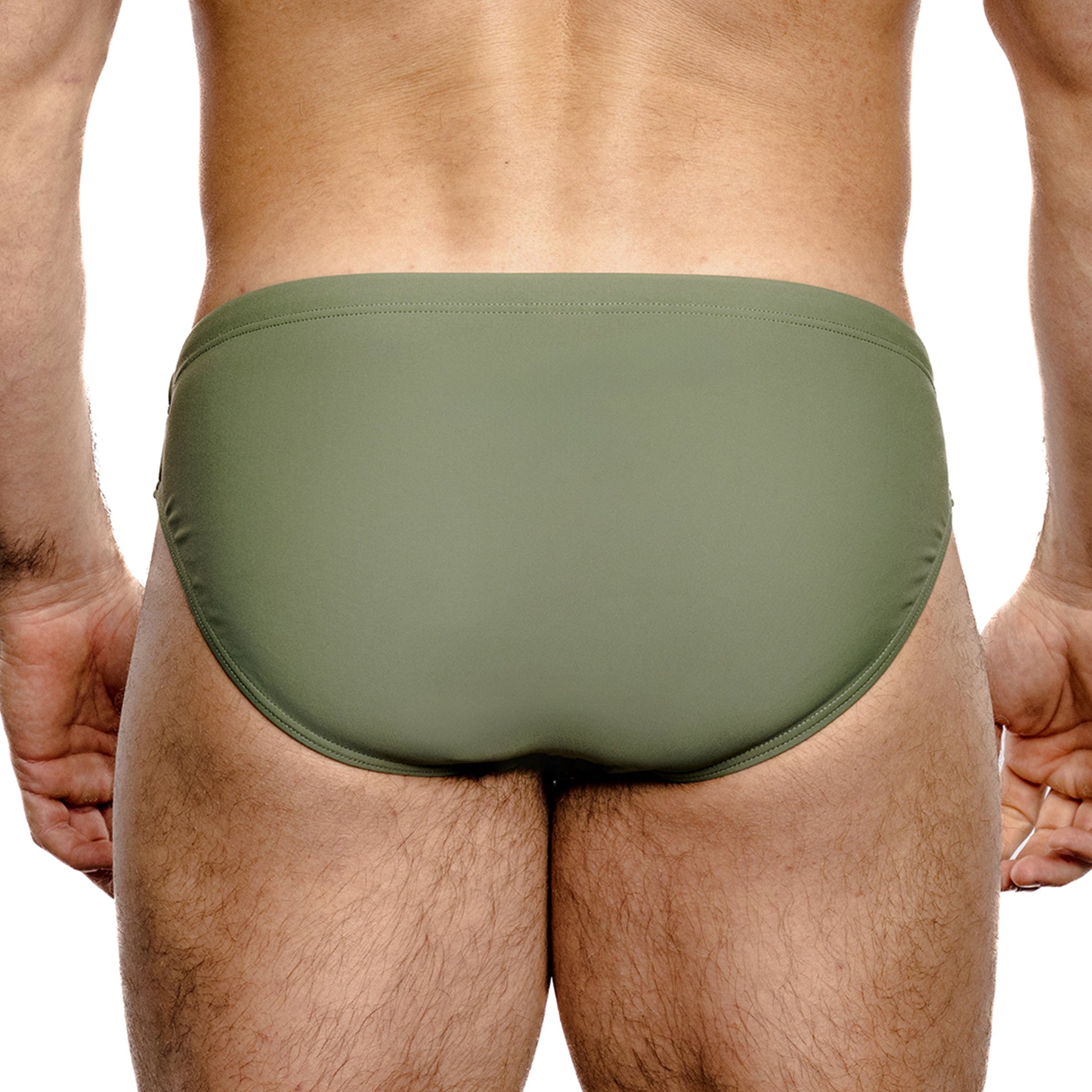 Green men's swim brief on a white background
