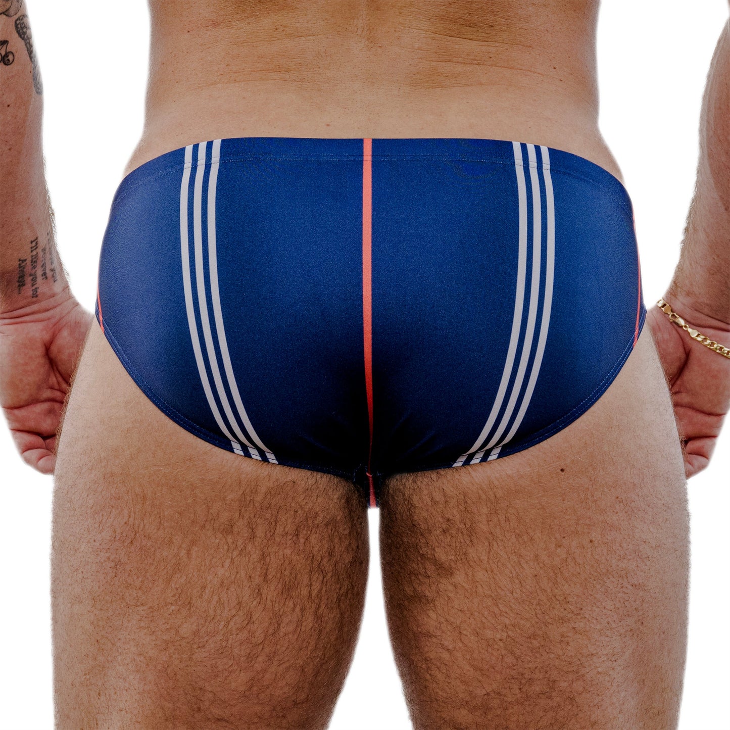 Blue men's swim suit with white stripes and a red accent on a white background