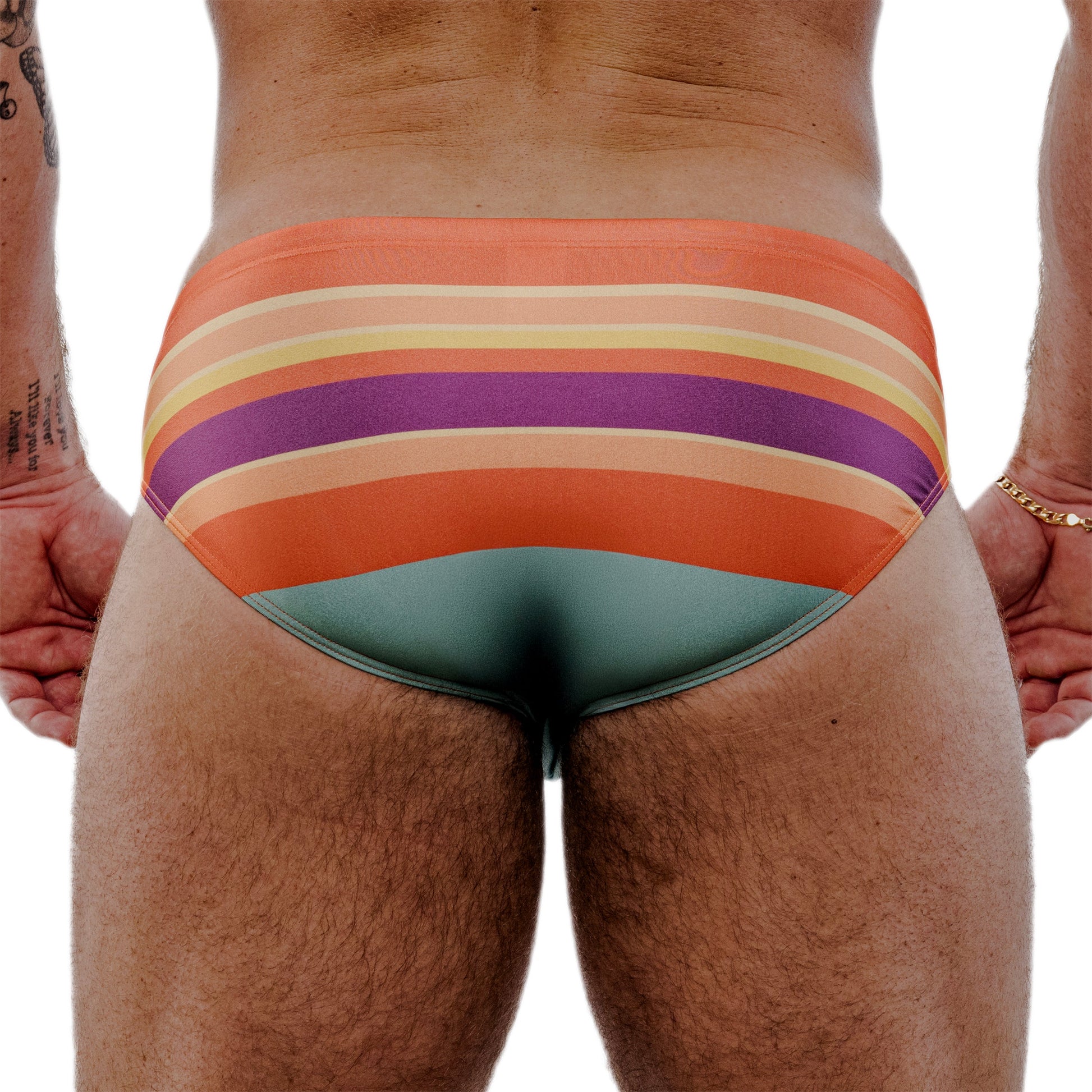 Multicolored striped swimsuit on a person against a white background