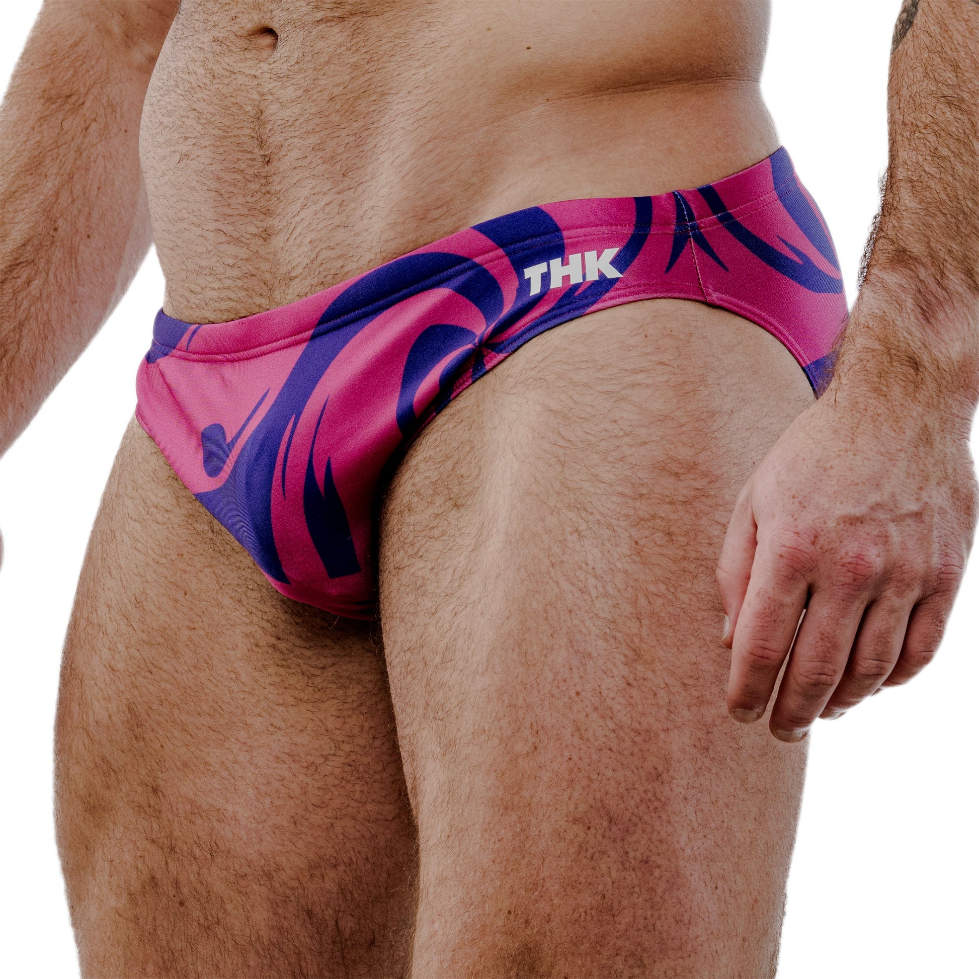 Pink and purple swim briefs with 'THK' branding on a white background