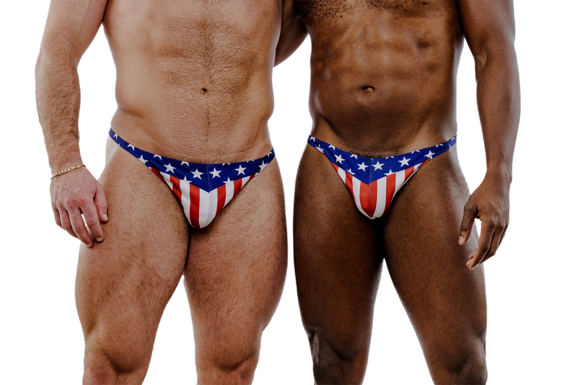 Two men wearing American flag-themed swimwear on a white background