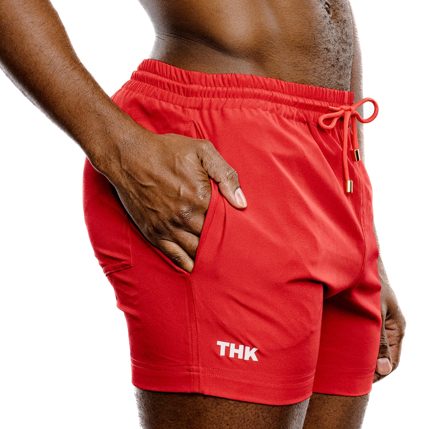 Red men's swim wear with 'THK' branding on a white background