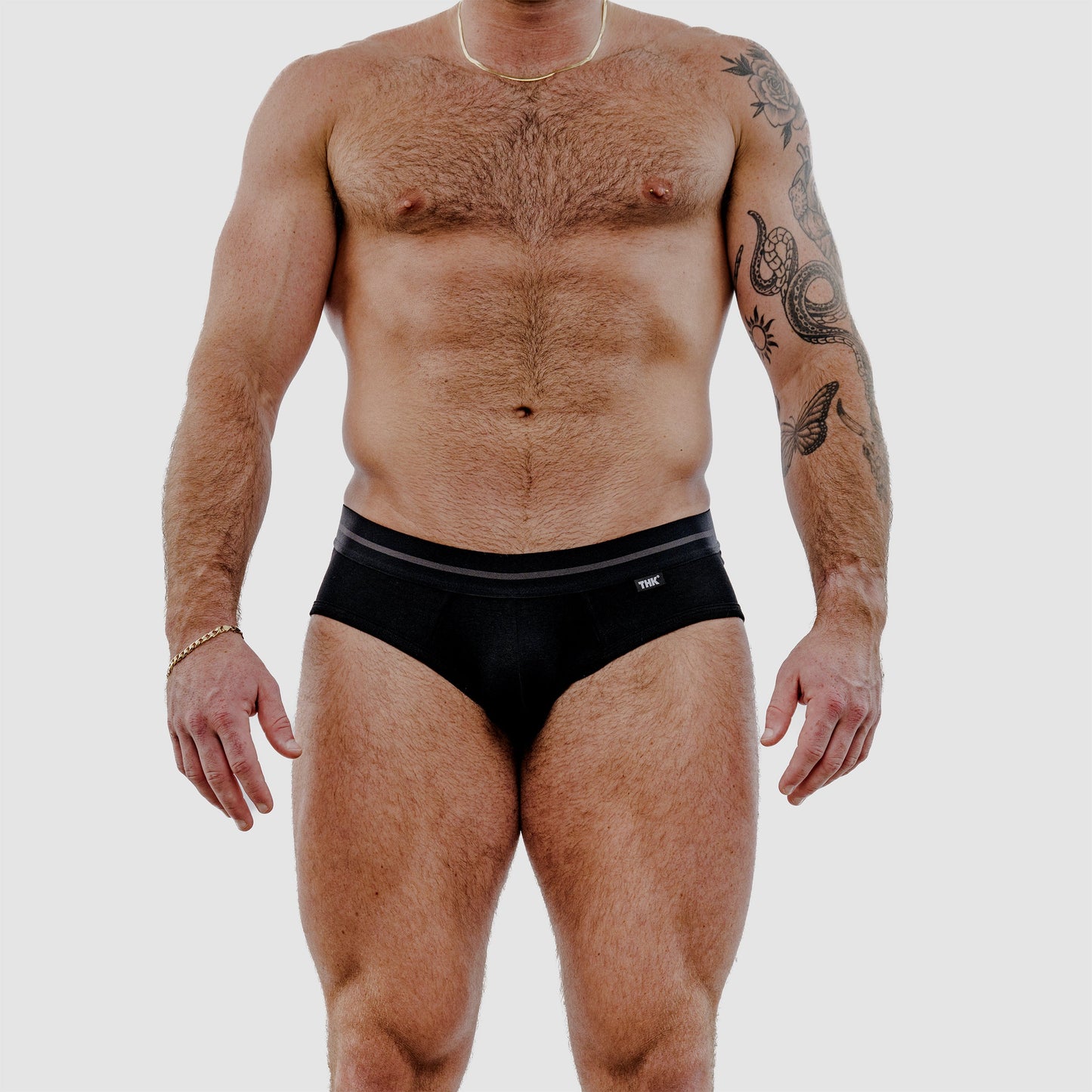 Man wearing black underwear on a white background