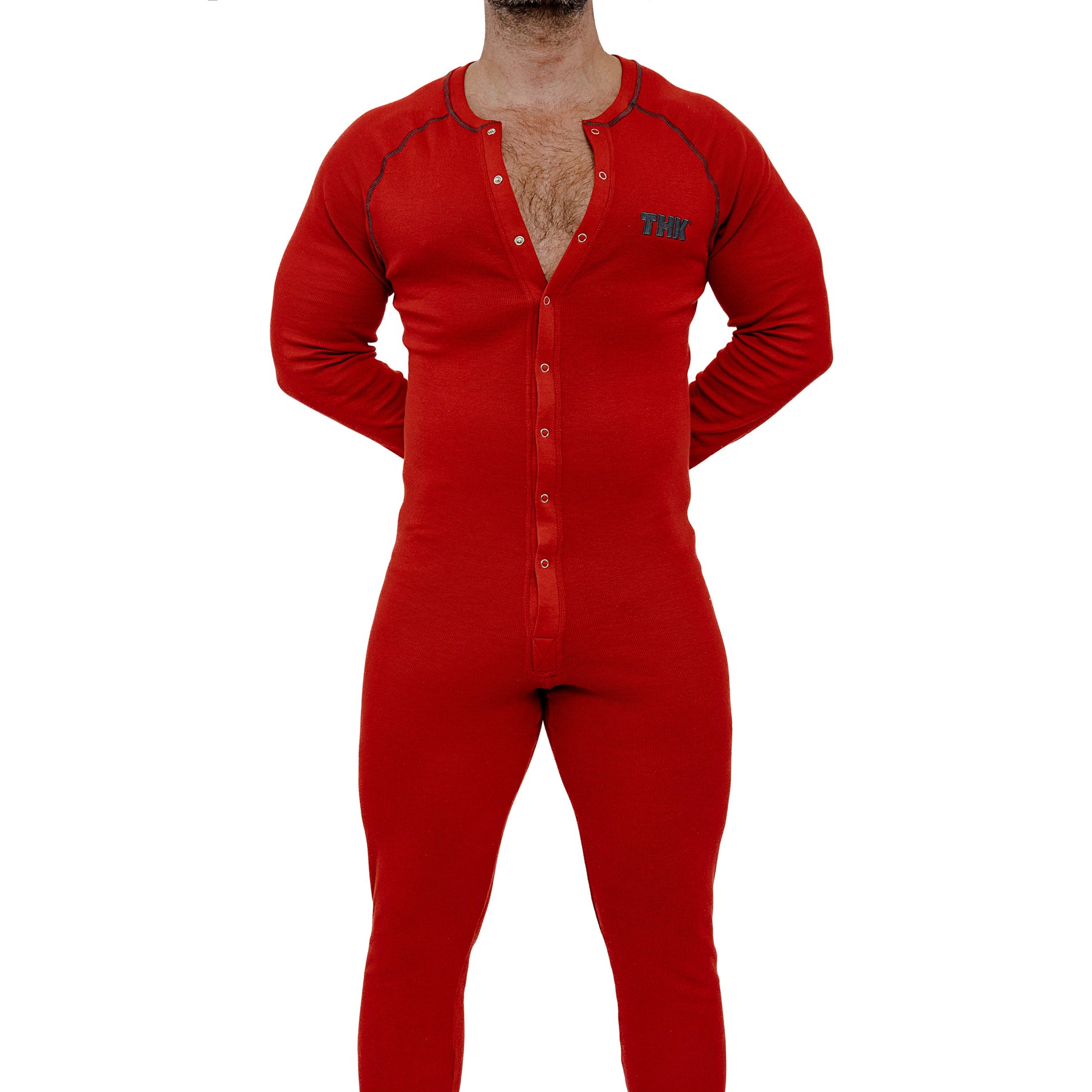 Red adult onesie worn by a person on a white background
