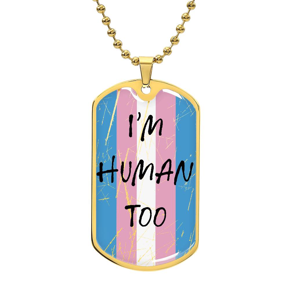 A gold necklace with a pendant featuring the transgender pride flag colors and the text 'I'm Human Too'.
