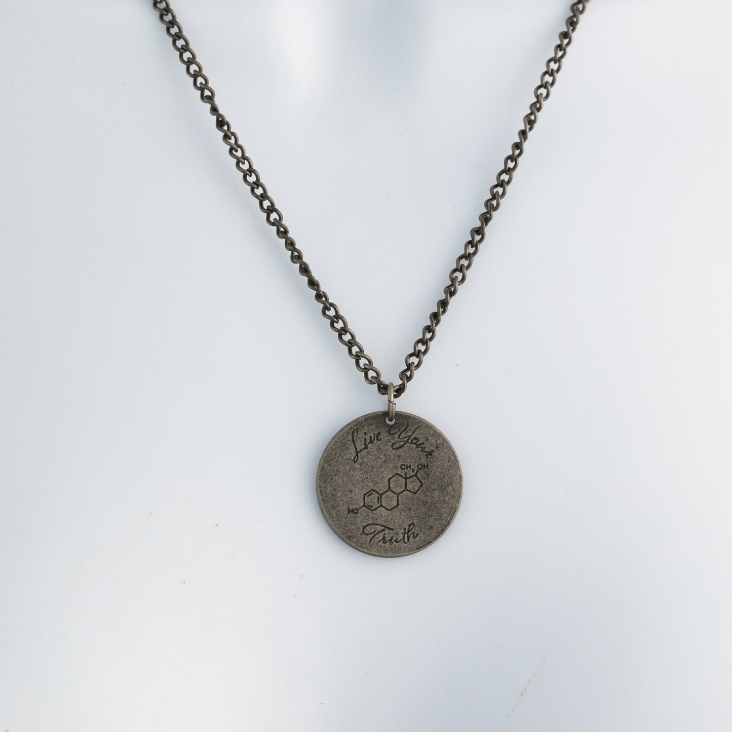 Necklace with a pendant on a mannequin against a white background
