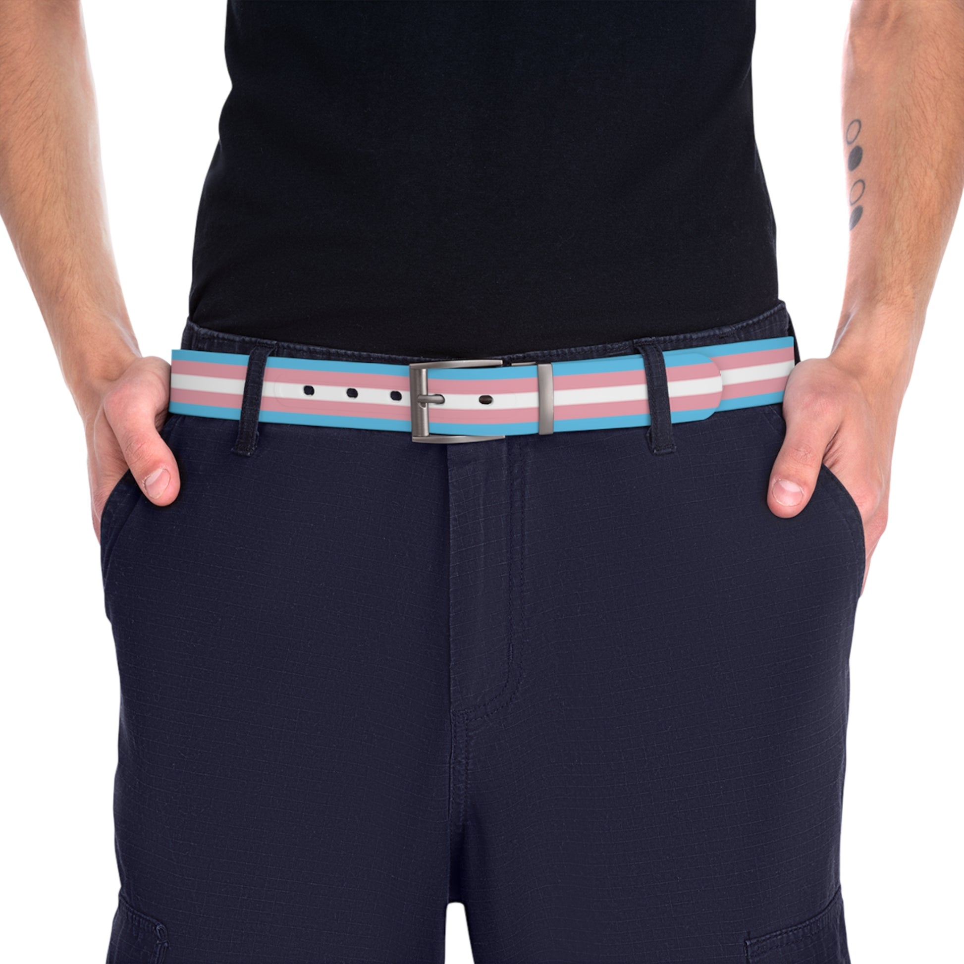 Person wearing navy shorts with a trans pride striped belt on a white background
