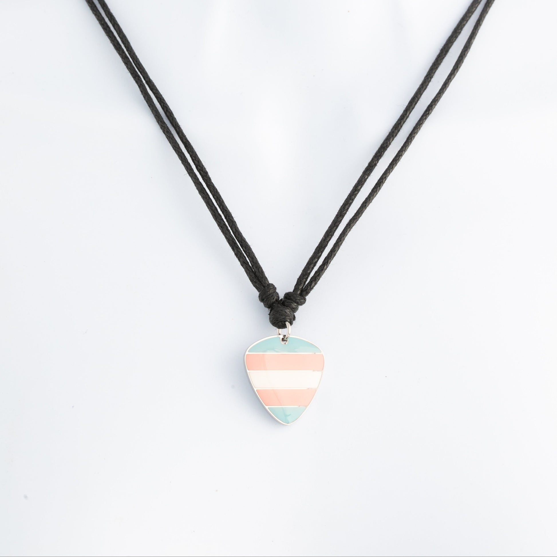 Necklace with a striped trans pride guitar pick pendant on a white background
