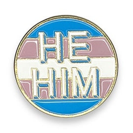 Round enamel pin with 'HE HIM' text  with trans pride colors on a white background
