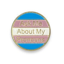 Trans pride colored lapel pin with 'Ask Me About My Pronouns' text on a white background