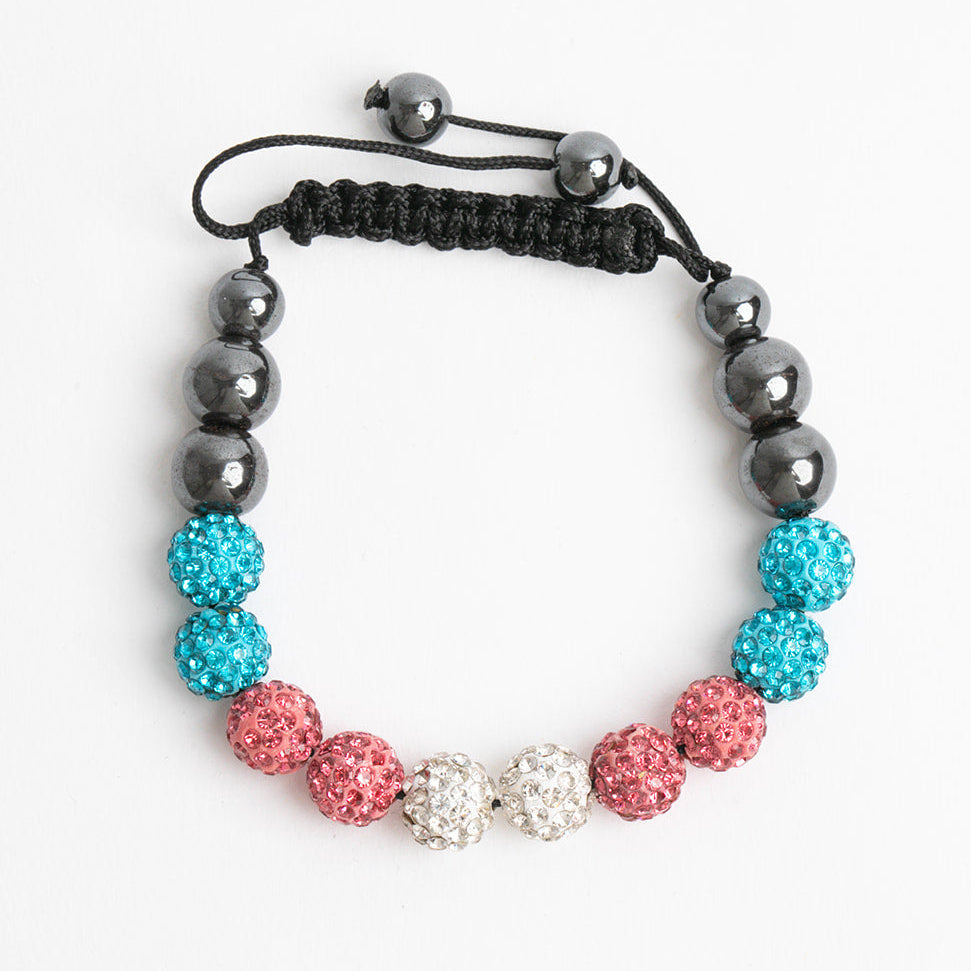 Bracelet with transgender pride colored beads on a white background