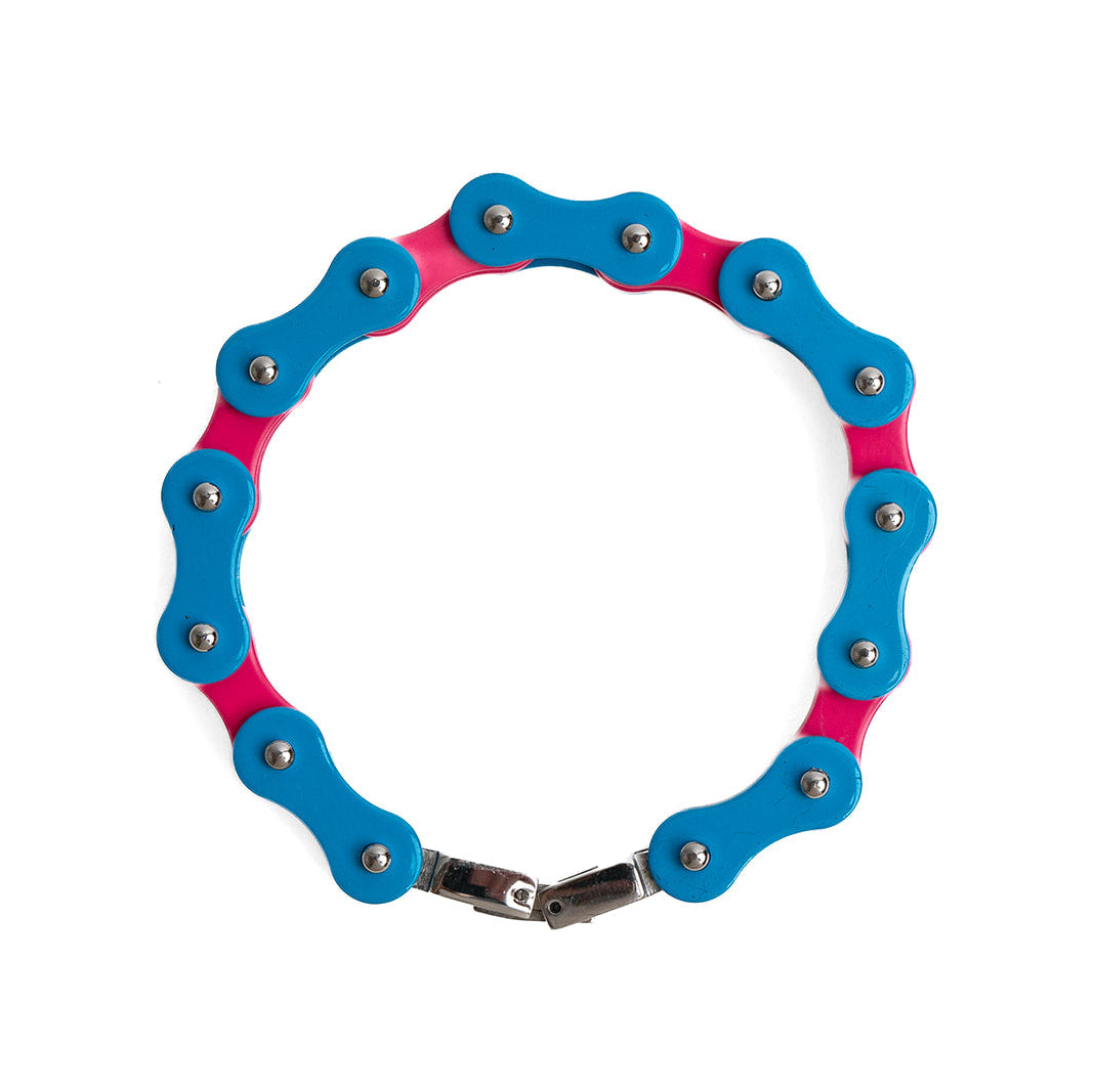 Blue and pink trans pride bracelet made from a bicycle chain on a white background