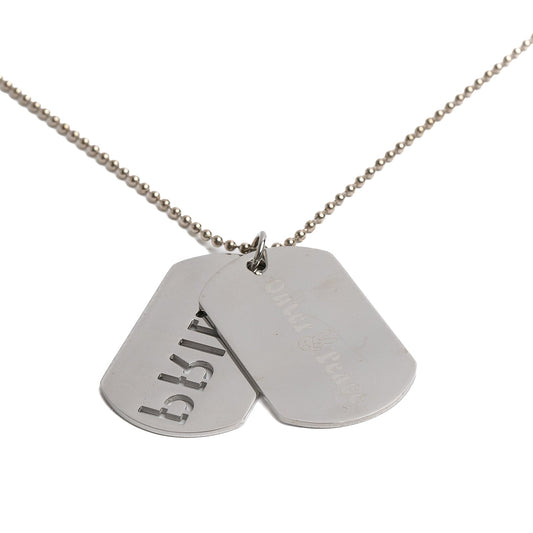 back of silver necklace with two engraved dog tags on a white background