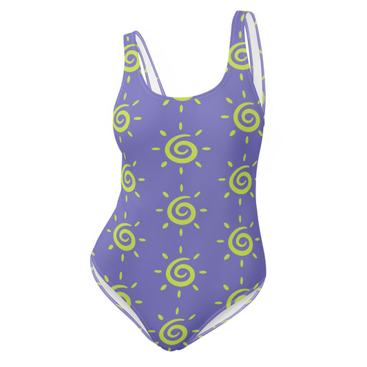 blue swimsuit with yellow sunburst patterns on a white background