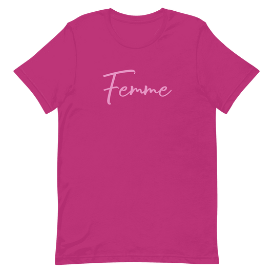 A pink t-shirt with the word 'Femme' written across the front in a white script font.